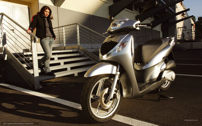 Woman with silver scooter