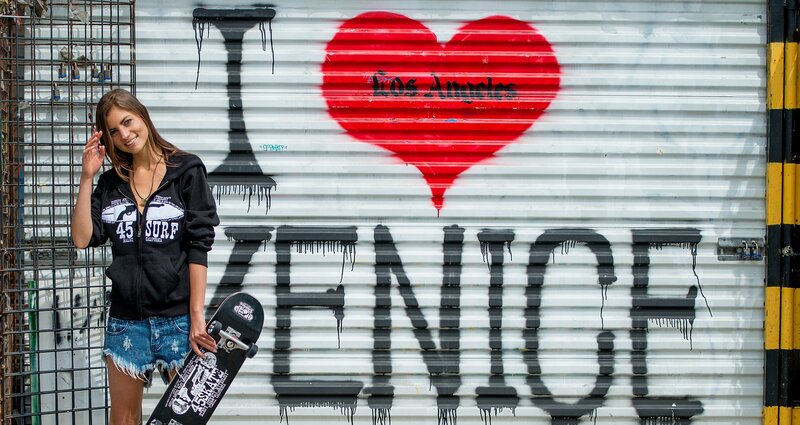 Woman with skateboard in Venice