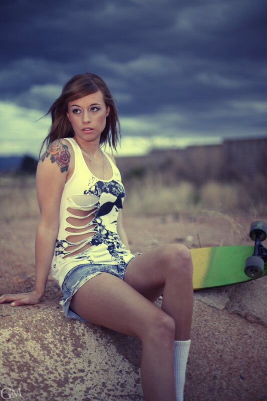 woman with skateboard outdoors