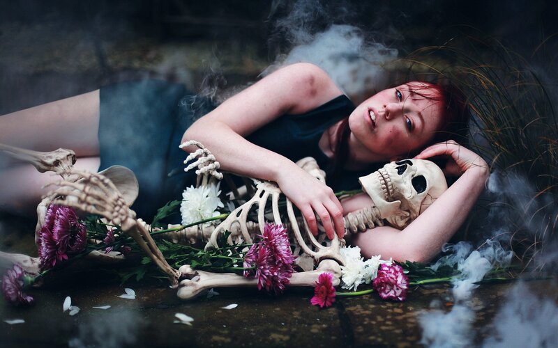 woman with skeleton and flowers