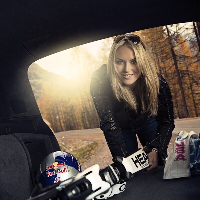 woman with ski gear in car
