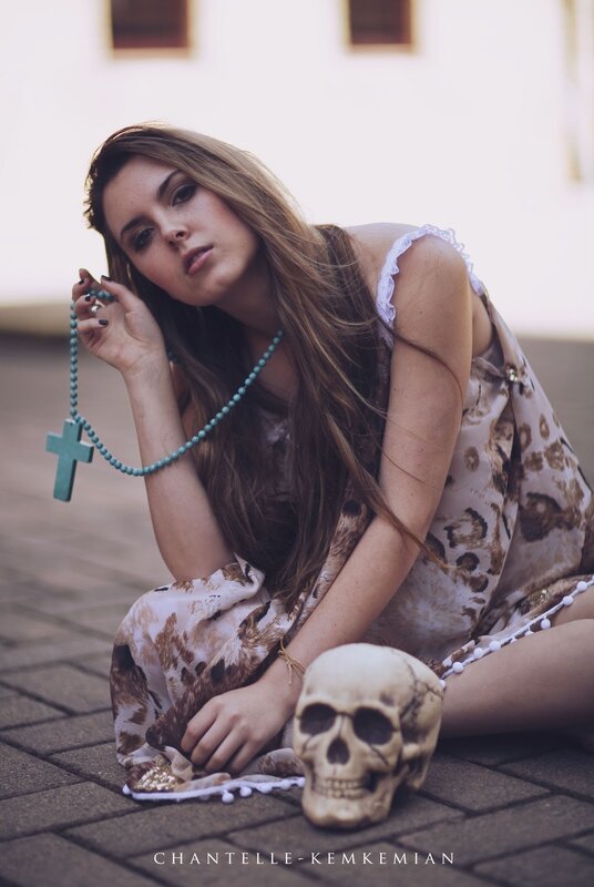 woman with skull and rosary