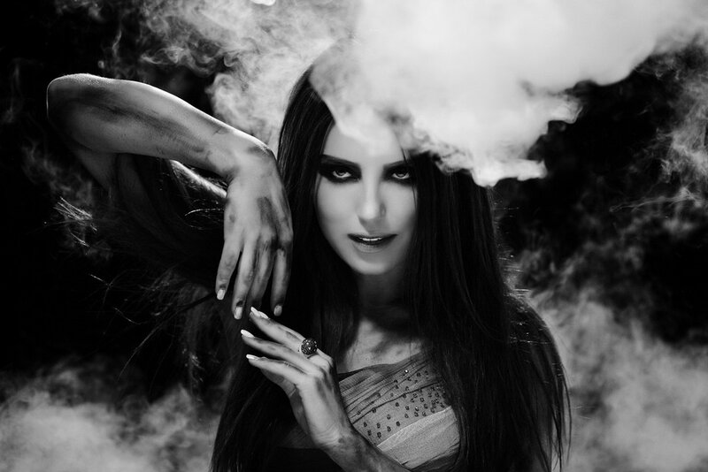 woman with smoke and dark makeup