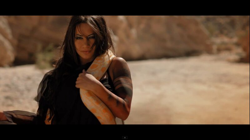 woman with snake in desert