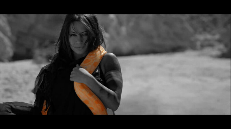 woman with snake in desert