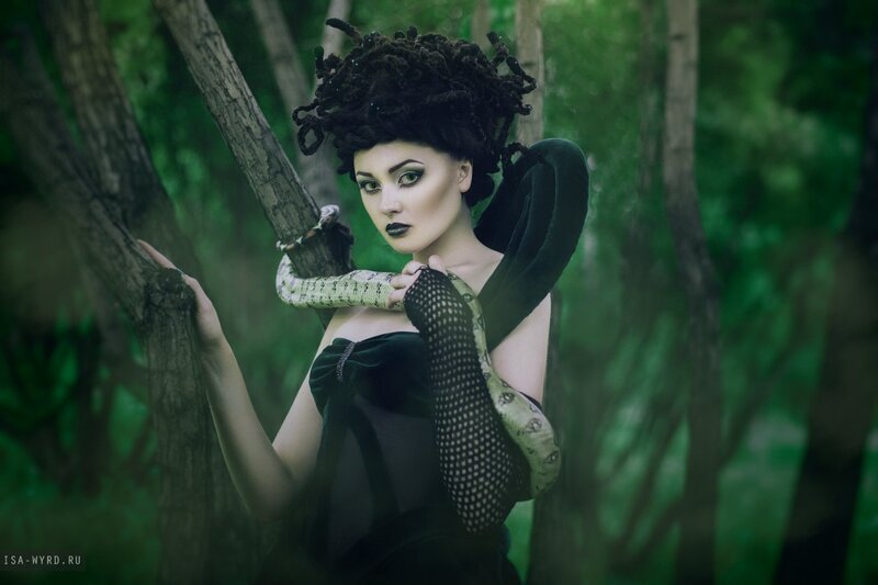 Woman with Snake in Forest — Green, Dramatic