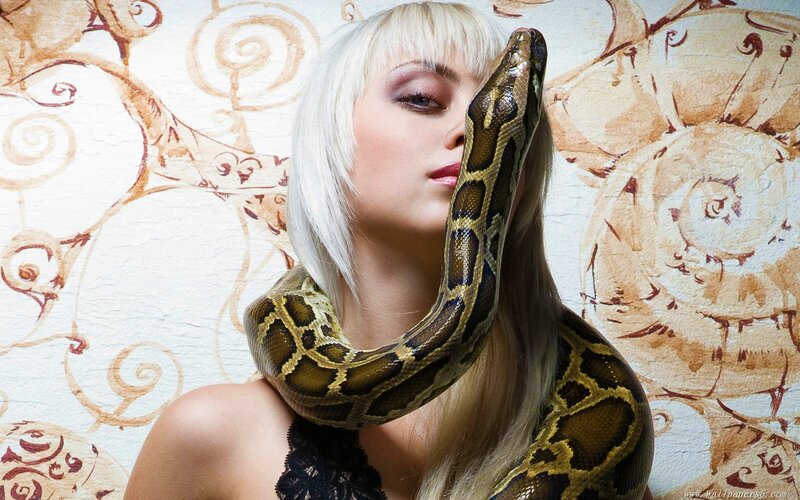 woman with snake on shoulder