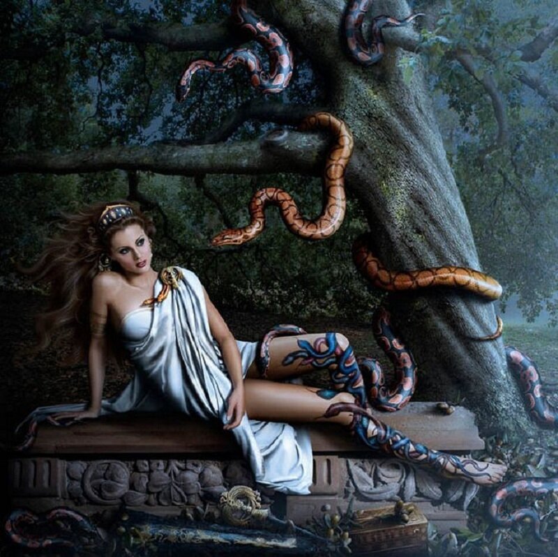 woman with snakes in forest