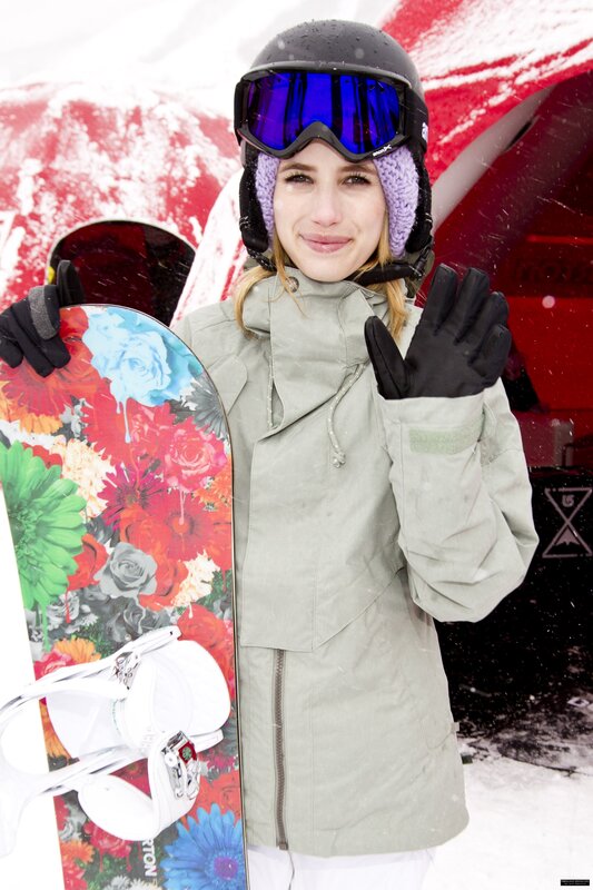 woman with snowboard in snow