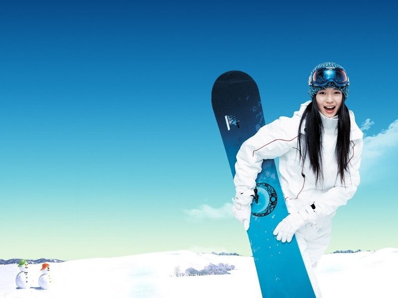 woman with snowboard in winter