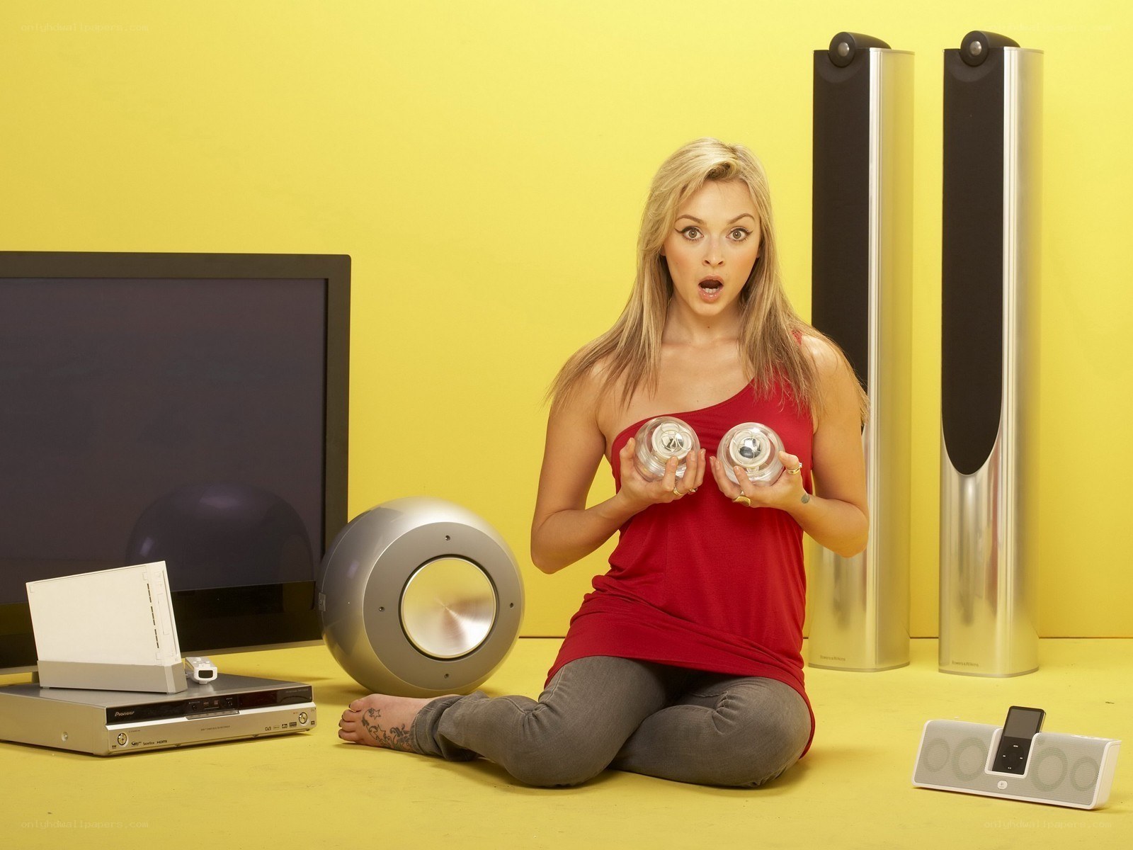 Woman with speakers and electronics