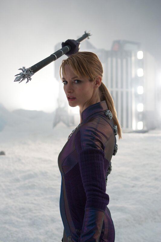 Woman with spear in snowy landscape