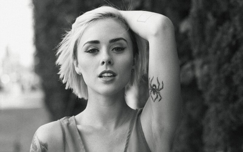 woman with spider tattoo