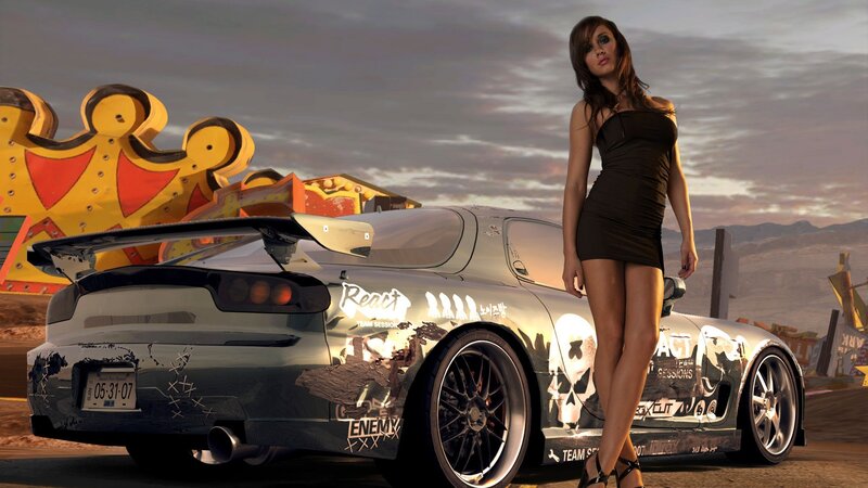 woman with sports car at sunset