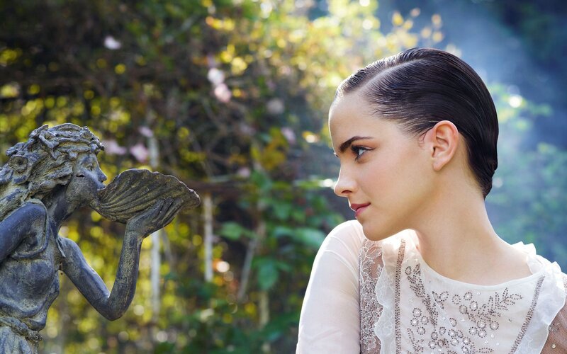 woman with statue in garden