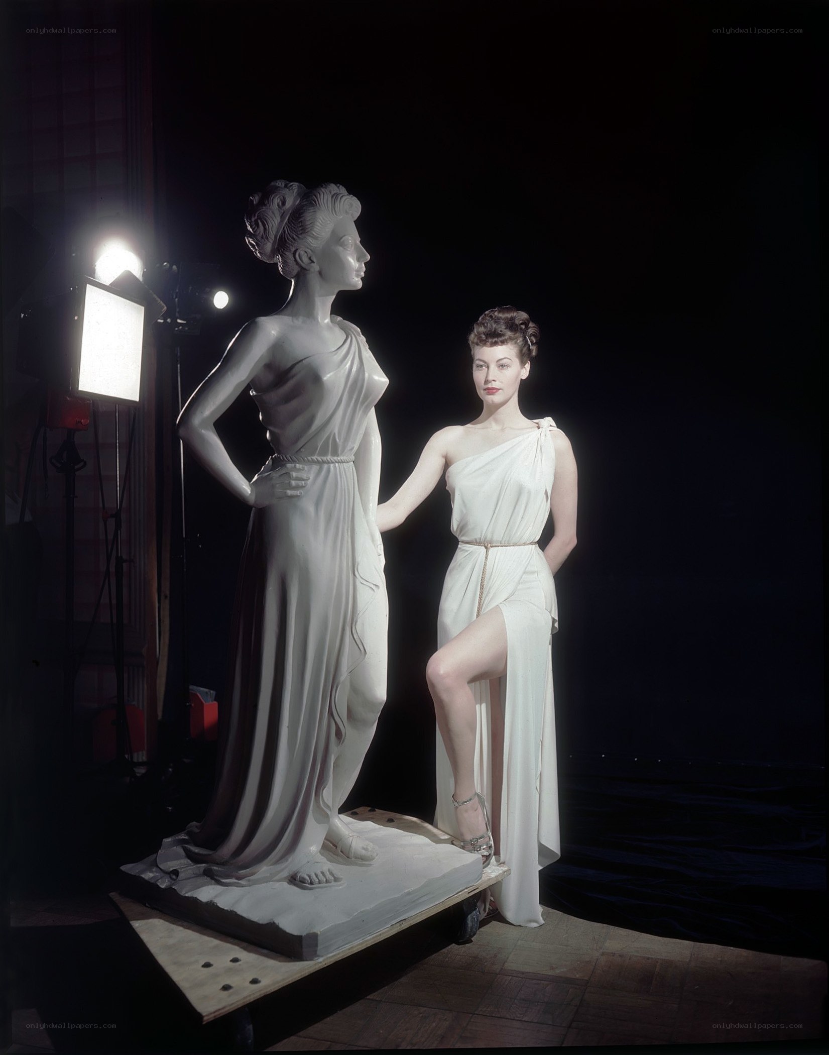Woman with statue in studio