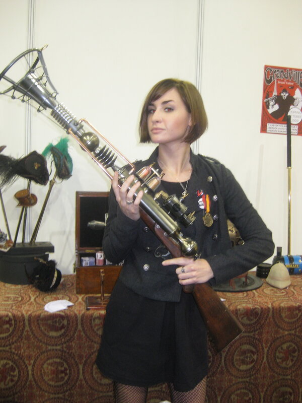 Woman with steampunk rifle