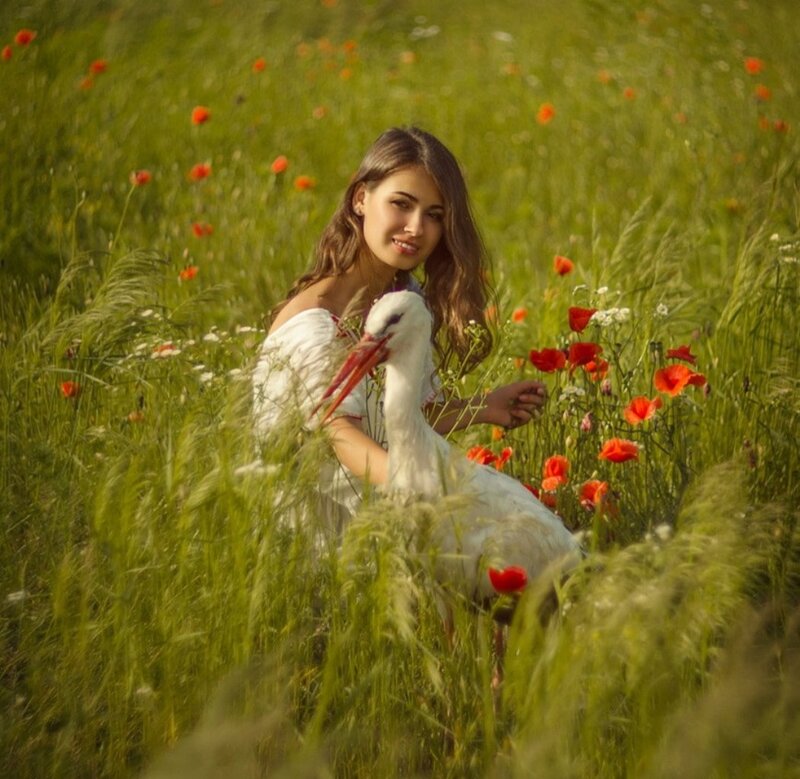 Woman with Stork in Field
