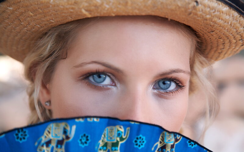 woman with straw hat and scarf