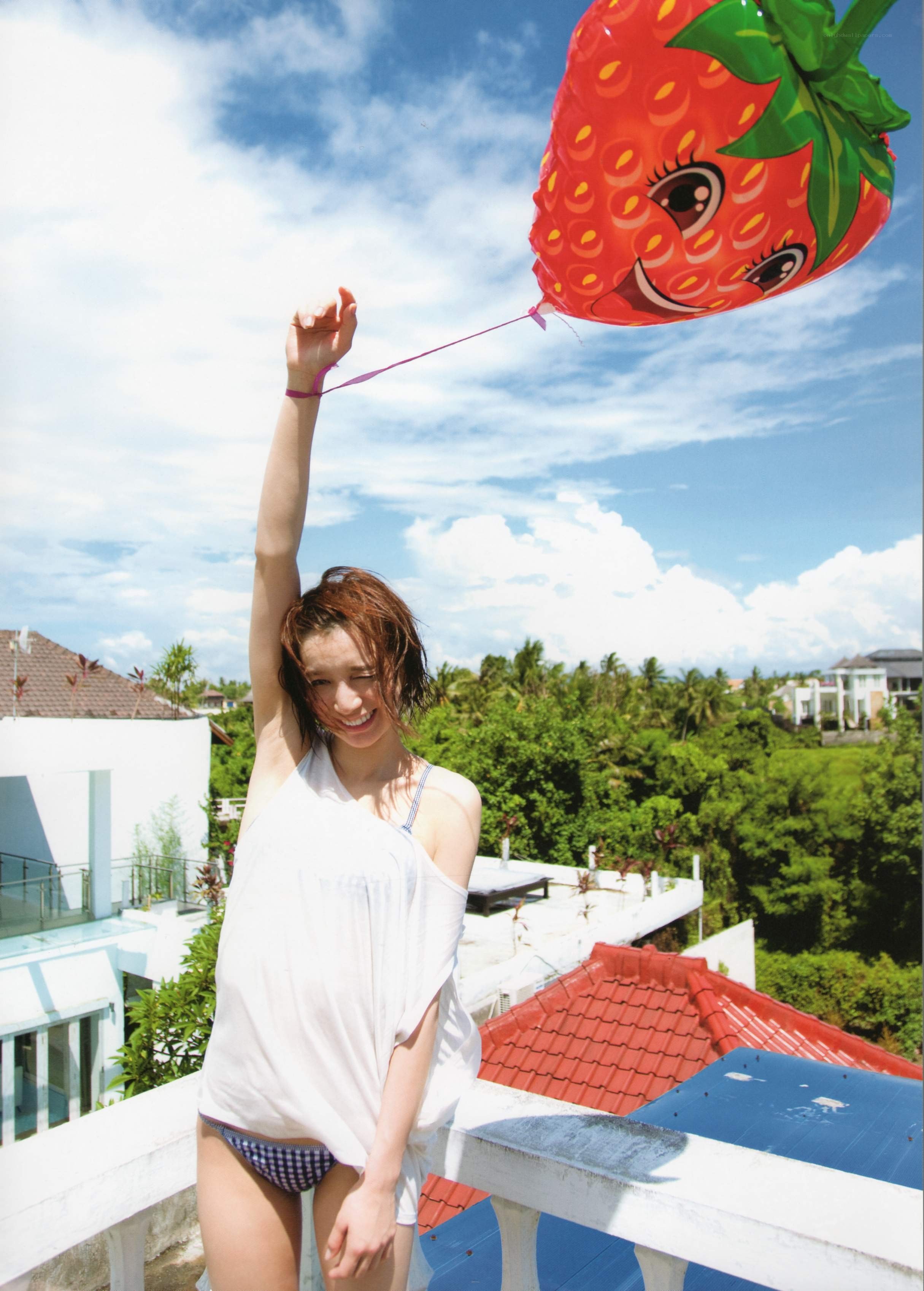 Woman with strawberry balloon