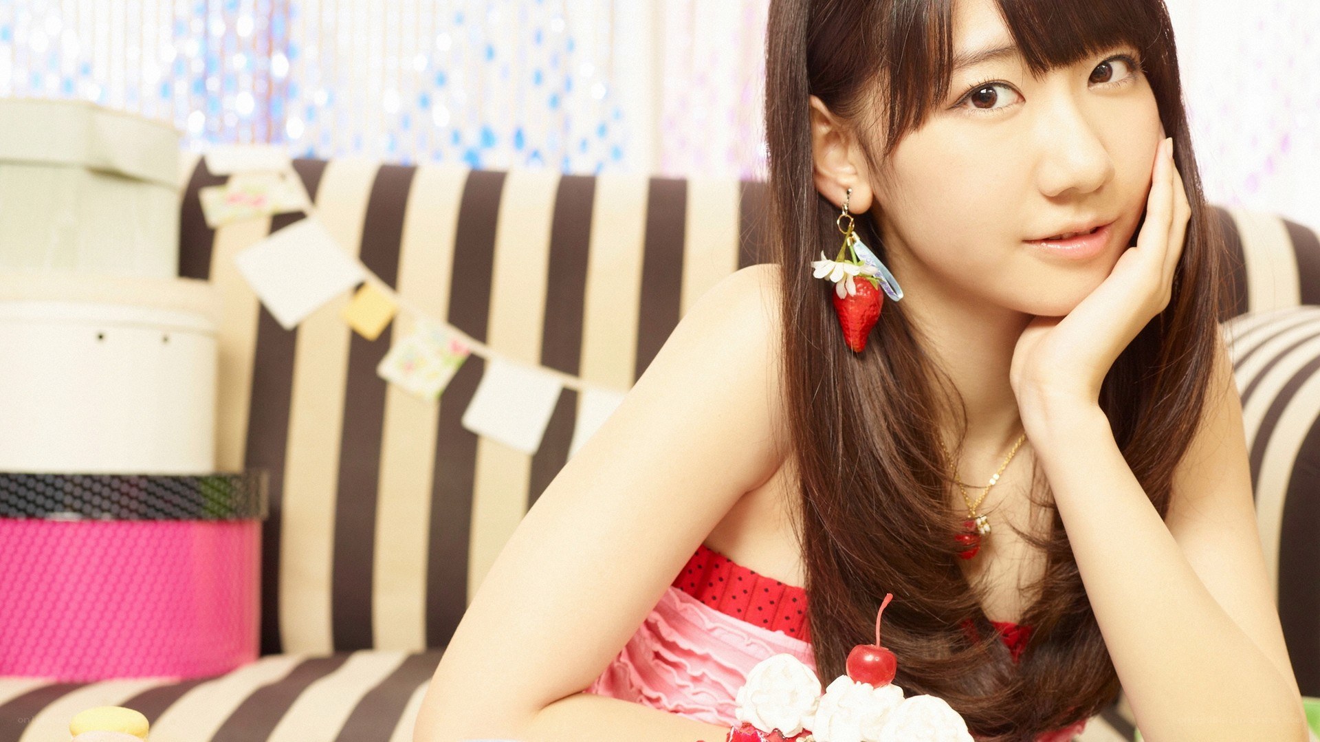 woman with strawberry earrings