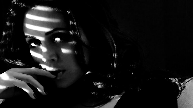 woman with striped light on face