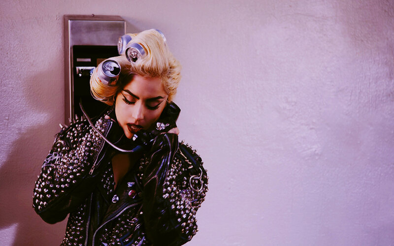 woman with studded jacket on phone