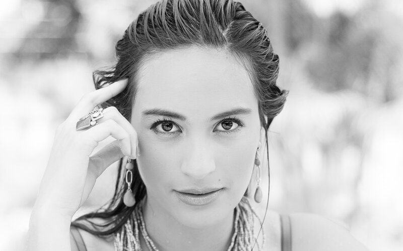 woman with styled hair and jewelry