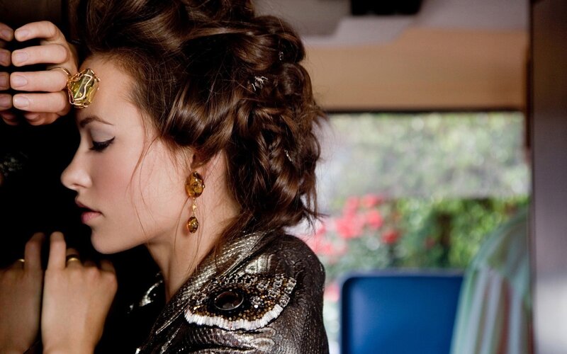 woman with styled hair and jewelry