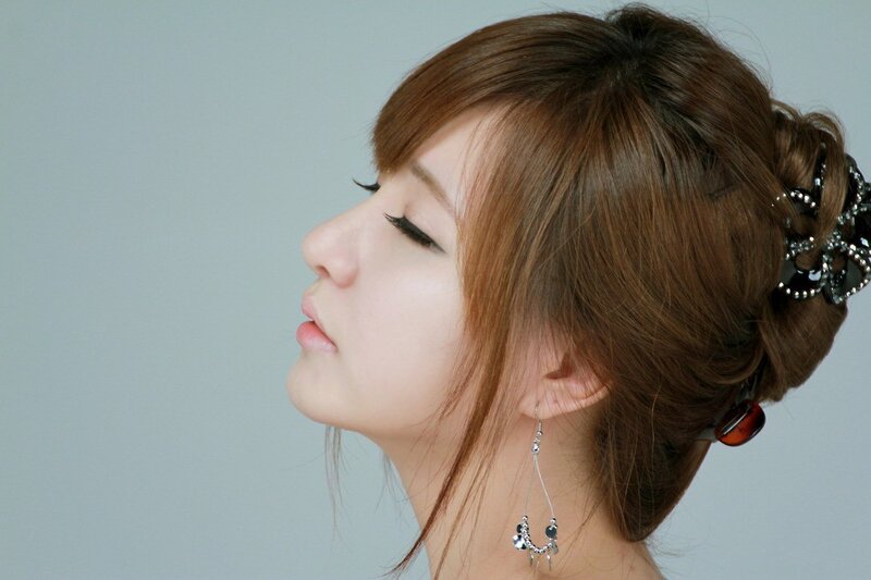 woman with styled hair in profile