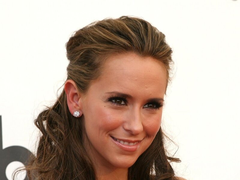 woman with styled hair smiling
