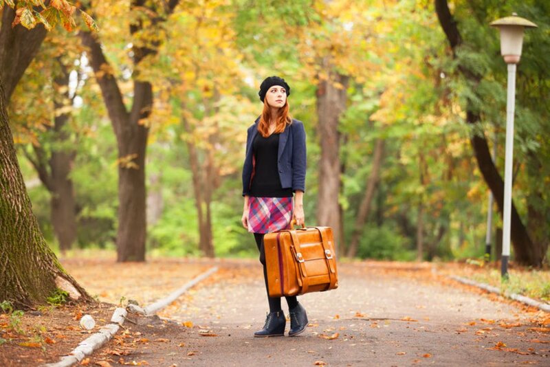 Woman with Suitcase — Brown, Contemplative