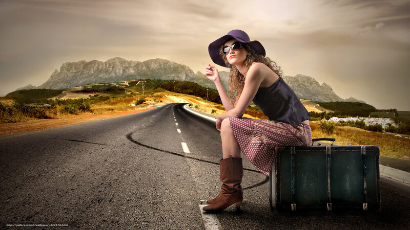 woman with suitcase on road