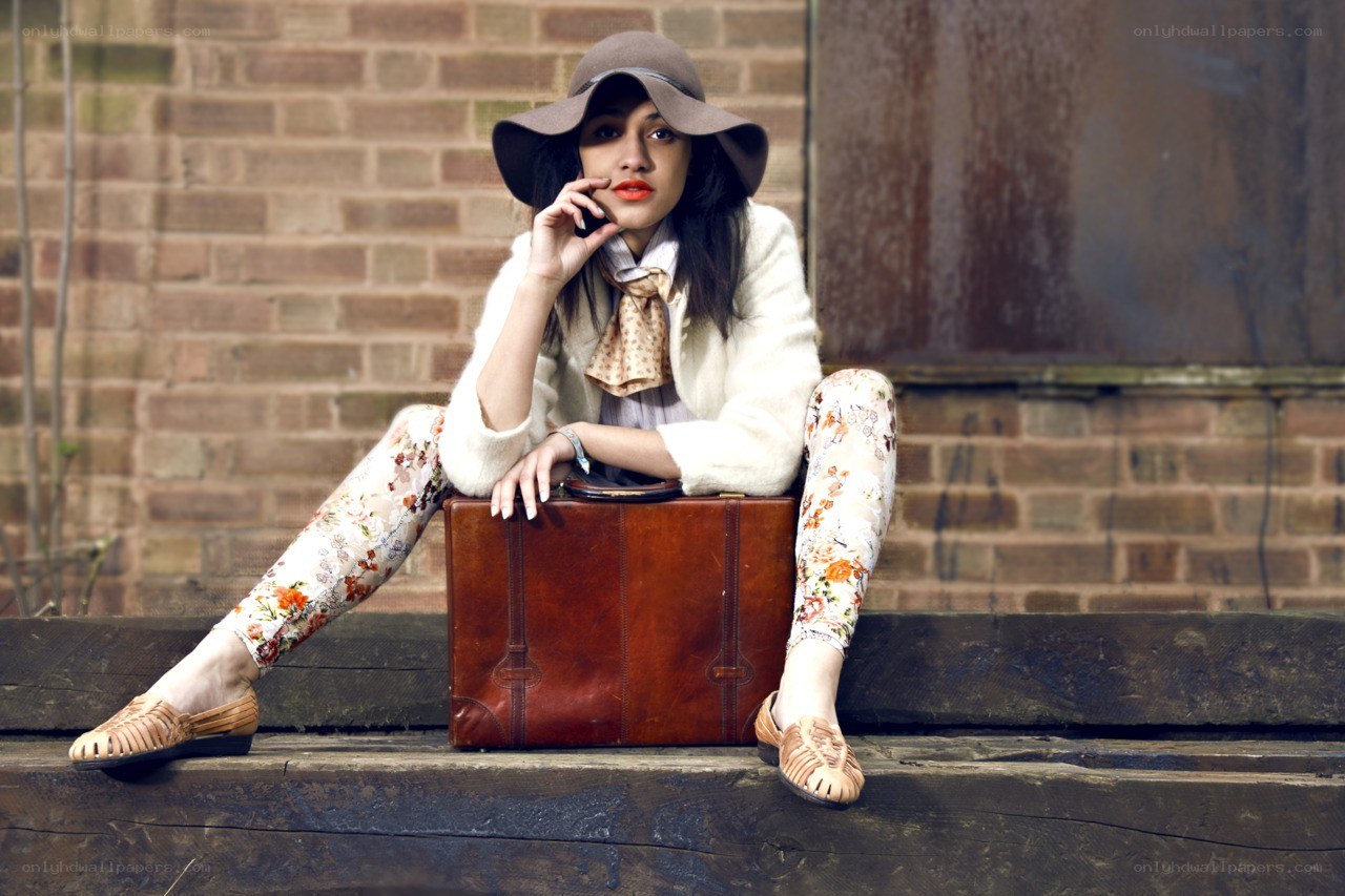 woman with suitcase on steps