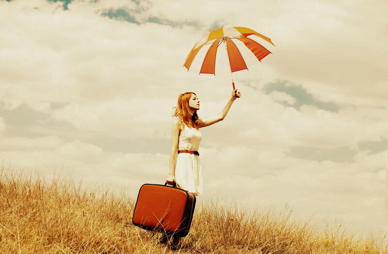 Woman with Suitcase — Orange, Serene