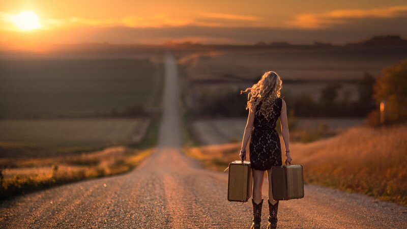 Woman with Suitcases