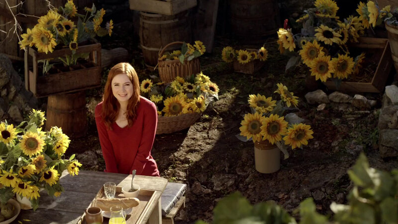 Woman with sunflowers outdoors