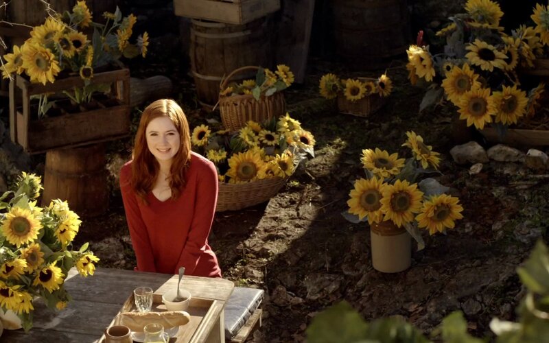 Woman with sunflowers outdoors