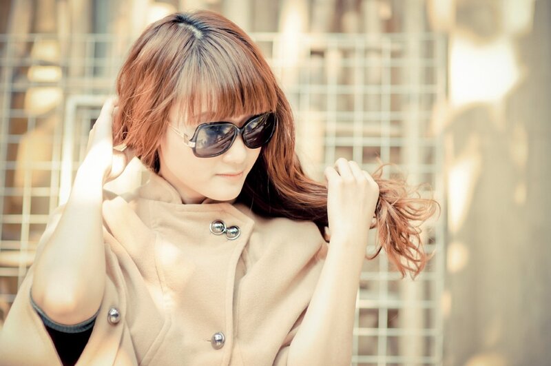 woman with sunglasses and coat