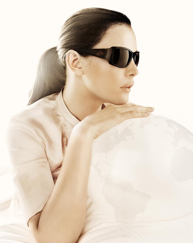 woman with sunglasses and globe