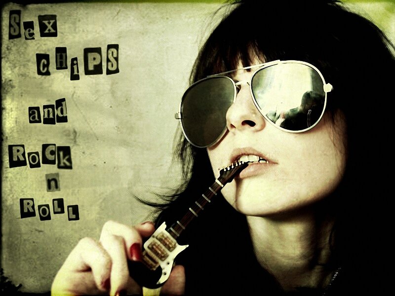 woman with sunglasses and guitar