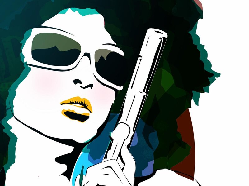 woman with sunglasses and gun