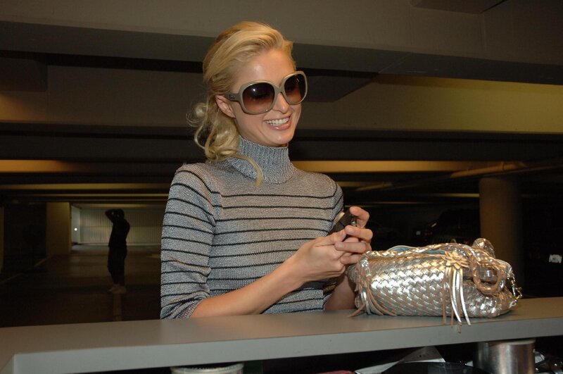 woman with sunglasses and handbag