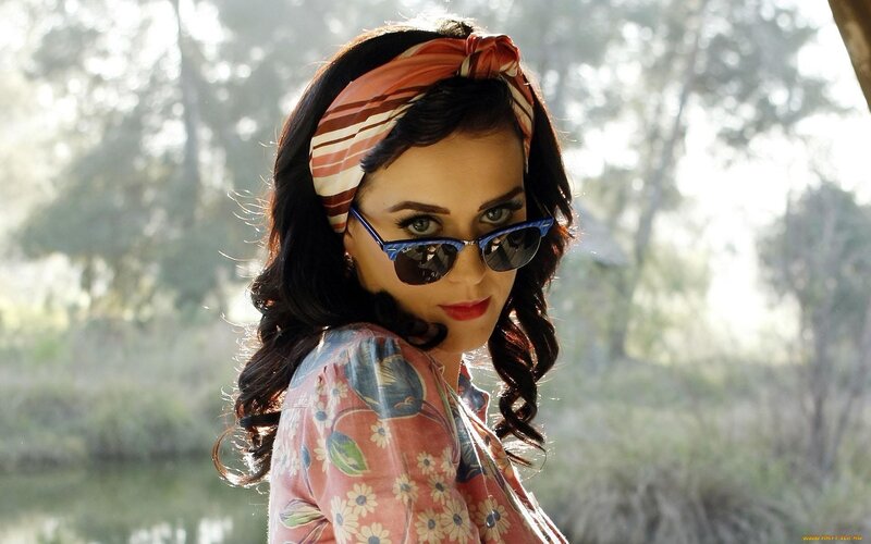 woman with sunglasses and headscarf