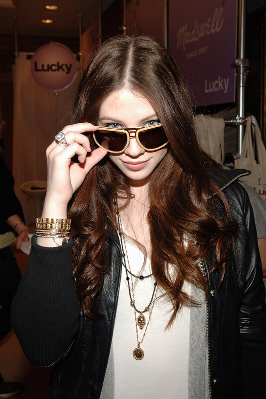 woman with sunglasses and jewelry