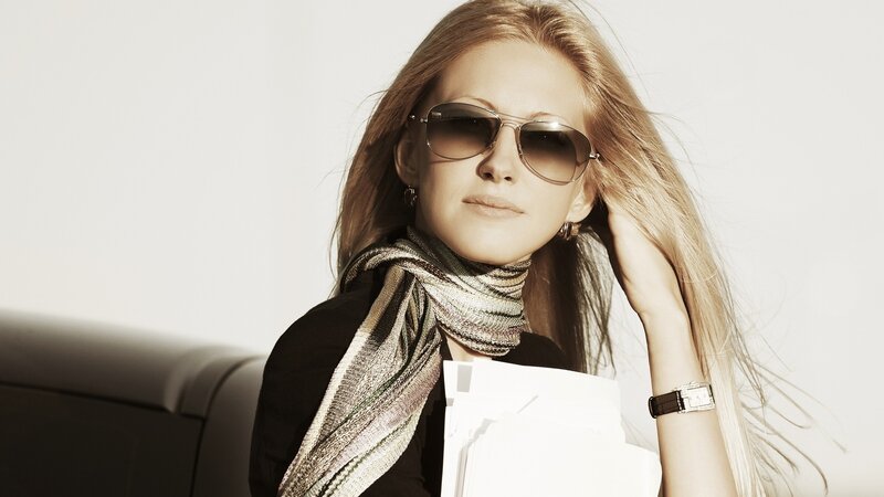 woman with sunglasses and scarf