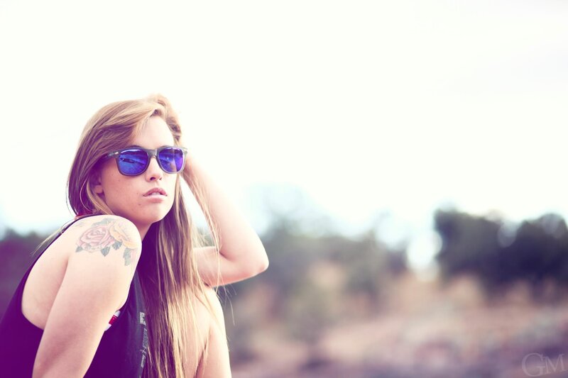 woman with sunglasses and tattoo