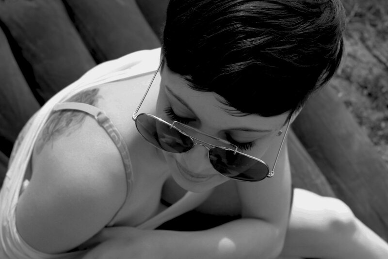 woman with sunglasses and tattoo