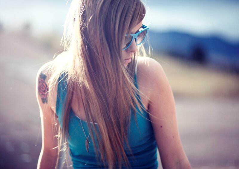 woman with sunglasses and tattoo