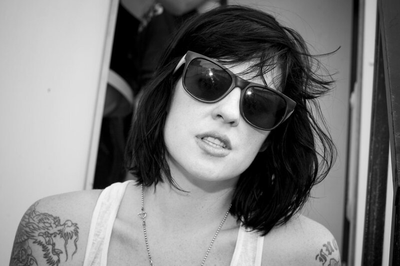 woman with sunglasses and tattoos